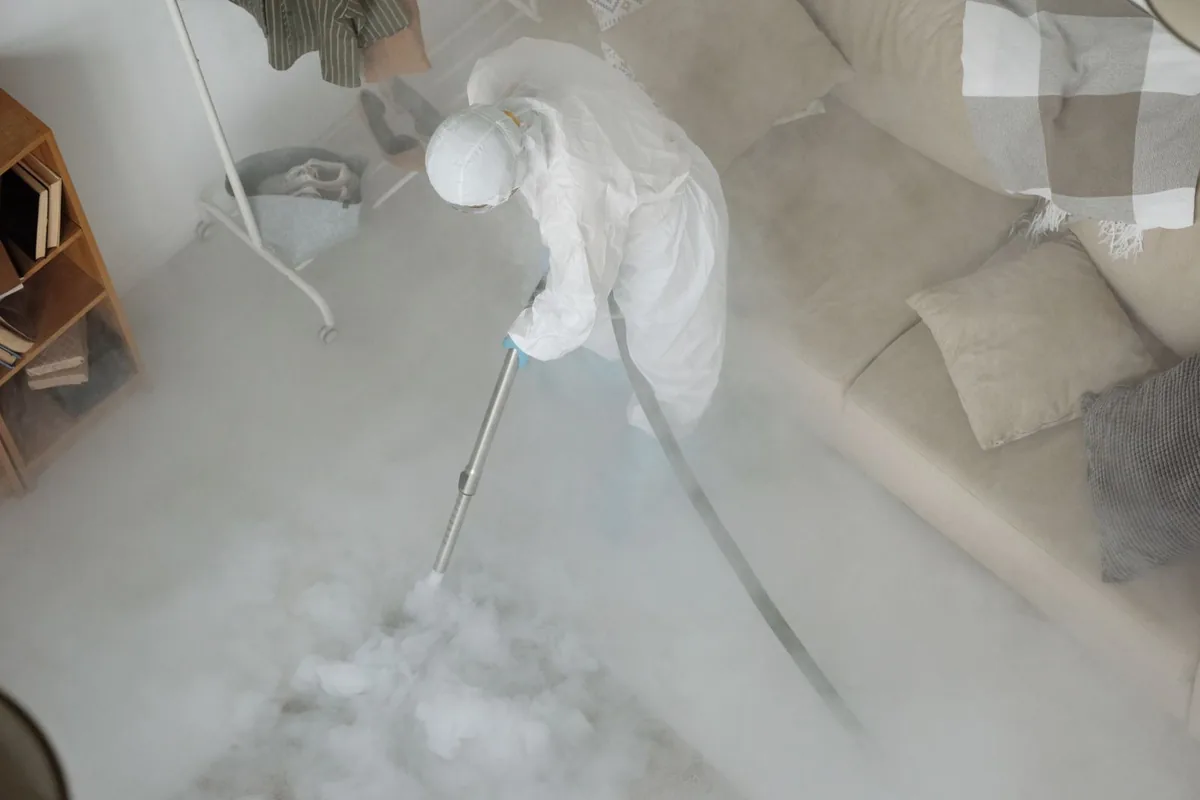 Biohazard cleanup technician in protective equipment, Northport, NY